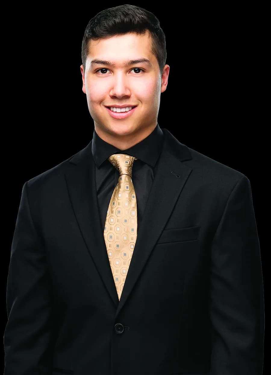 Justin Cheung, REALTOR®, in a dark suit with a gold tie